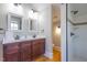 A bathroom boasts a double vanity, mirrors, and a separate shower stall at 1426 N Roxboro St, Durham, NC 27701