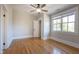 A bedroom features hardwood floors and large windows to create a warm ambiance at 1426 N Roxboro St, Durham, NC 27701