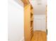 Walk in closet featuring wooden shelving, hardwood floors, and white walls at 1426 N Roxboro St, Durham, NC 27701
