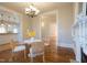 Bright dining area features hardwood floors, white trim, and adjacent kitchen for easy entertaining at 1426 N Roxboro St, Durham, NC 27701