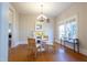 Sunlit dining area boasts hardwood floors, neutral tones, and a decorative fireplace for cozy gatherings at 1426 N Roxboro St, Durham, NC 27701
