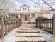 Charming home featuring a welcoming front porch with brick stairs and a beautifully landscaped front yard at 1426 N Roxboro St, Durham, NC 27701