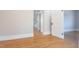 Hallway view with hardwood floors, neutral walls, and white trim at 1426 N Roxboro St, Durham, NC 27701