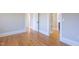 A hallway shows multiple rooms with open doorways and hardwood floors at 1426 N Roxboro St, Durham, NC 27701