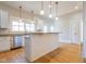Spacious kitchen with stainless steel appliances, granite countertops, and hardwood flooring, perfect for culinary enthusiasts at 1426 N Roxboro St, Durham, NC 27701