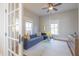 Stylish living room featuring a modern sofa, a glass coffee table, and plenty of natural light at 1426 N Roxboro St, Durham, NC 27701