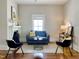 Inviting living room with modern decor, fireplace, neutral color palette, and hardwood flooring at 1426 N Roxboro St, Durham, NC 27701