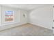 Inviting bedroom with two windows providing natural light, complemented by soft neutral carpeting at 1430 Cooper St, Sanford, NC 27330