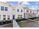 Attractive townhome with modern architecture, featuring a combination of white siding and stone details at 1430 Cooper St, Sanford, NC 27330