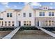 Charming townhome showcasing a combination of white siding and stone accents at 1430 Cooper St, Sanford, NC 27330