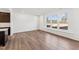 Bright living room featuring hardwood floors, large windows with backyard views, and an open concept design at 1430 Cooper St, Sanford, NC 27330