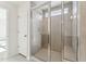 Modern bathroom shower showcasing sleek glass doors and contemporary tile work at 1430 Cooper St, Sanford, NC 27330