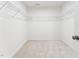 Spacious walk-in closet with wire shelving, offering ample storage and organization space at 1430 Cooper St, Sanford, NC 27330