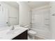 Bathroom features a single sink vanity, toilet, and shower-tub combination at 1432 Cooper St, Sanford, NC 27330
