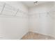 Walk in closet with wire shelving and carpeted floor at 1432 Cooper St, Sanford, NC 27330