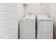 Functional laundry room with white washer and dryer at 1432 Cooper St, Sanford, NC 27330