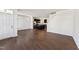 Inviting open-concept living area with dark wood floors flowing into modern kitchen at 1432 Cooper St, Sanford, NC 27330