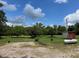 Image of a backyard with gravel and a propane tank at 148 Baptist Church Rd, Henderson, NC 27537