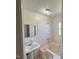 Bathroom featuring a tub with tile surround and pedestal sink at 148 Baptist Church Rd, Henderson, NC 27537