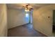Spacious bedroom featuring carpeted floors, ceiling fan, and a window at 148 Baptist Church Rd, Henderson, NC 27537