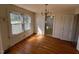 Dining room with hardwood flooring and windows offering natural light at 148 Baptist Church Rd, Henderson, NC 27537