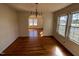 Dining room with hardwood flooring and windows offering natural light at 148 Baptist Church Rd, Henderson, NC 27537
