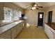 Kitchen features white cabinets and windows with natural lighting at 148 Baptist Church Rd, Henderson, NC 27537