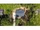 Aerial view of home surrounded by lush greenery showing roof, driveway, and landscape at 149 Amber Rd, Timberlake, NC 27583