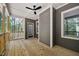 The spacious back porch features a ceiling fan and a view of the wooded backyard at 149 Amber Rd, Timberlake, NC 27583