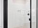 Modern bathroom shower with glass door, white tile, and black hardware at 149 Amber Rd, Timberlake, NC 27583