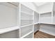 Spacious walk-in closet with built-in shelving and hanging rods, offering ample storage at 149 Amber Rd, Timberlake, NC 27583