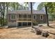 Exterior view of home featuring wood deck, yard, and a lush treeline at 149 Amber Rd, Timberlake, NC 27583