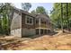 Side view of home featuring a walkout basement and wood porch perfect for enjoying the outdoors at 149 Amber Rd, Timberlake, NC 27583