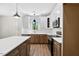 Well-lit kitchen with stainless steel appliances, white cabinetry, and an island prep area at 149 Amber Rd, Timberlake, NC 27583