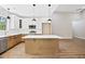 Spacious kitchen featuring an island, stainless steel appliances, and a window view at 149 Amber Rd, Timberlake, NC 27583