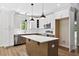 Modern kitchen with stainless steel appliances, an island, granite countertops and wooden floors at 149 Amber Rd, Timberlake, NC 27583