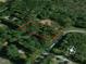 Aerial view of the property's land, bordered in red, situated among lush trees and rolling terrain at 149 Amber Rd, Timberlake, NC 27583