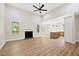 Spacious living room features hardwood floors, fireplace, and open-concept kitchen area at 149 Amber Rd, Timberlake, NC 27583
