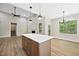 Bright living room features hardwood floors, large windows, a fireplace, and island seating at 149 Amber Rd, Timberlake, NC 27583
