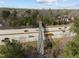 A unique aerial view showcases the pedestrian bridge over the busy highway, framed by mature trees at 1613 Bulon Dr, Cary, NC 27518