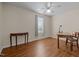 Cozy bedroom with hardwood floors, a ceiling fan, and natural light from the window at 1613 Bulon Dr, Cary, NC 27518