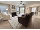 Bright living room featuring a fireplace, ceiling fan, sliding glass doors, and a neutral color palette at 1613 Bulon Dr, Cary, NC 27518
