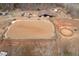 Aerial view of horse property with riding ring, stable, and outbuildings at 195 Falcon Ln, Rougemont, NC 27572