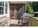 Enjoy outdoor cooking on the back porch with a gas grill and a wooden bench at 195 Falcon Ln, Rougemont, NC 27572