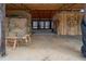 View of the barn's interior, featuring concrete flooring and ample storage space at 195 Falcon Ln, Rougemont, NC 27572