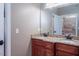 A double sink and vanity offer granite countertops and updated fixtures in this bathroom at 195 Falcon Ln, Rougemont, NC 27572