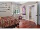 A bright bedroom features hardwood floors and a neutral colored wall, along with window views at 195 Falcon Ln, Rougemont, NC 27572