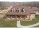 Inviting front exterior featuring a covered porch with rocking chairs at 195 Falcon Ln, Rougemont, NC 27572