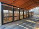 Exterior view of the horse barn featuring multiple horse stalls and an open beam ceiling at 195 Falcon Ln, Rougemont, NC 27572
