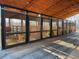 Exterior view of horse barn featuring open horse stalls with metal barred stall doors at 195 Falcon Ln, Rougemont, NC 27572